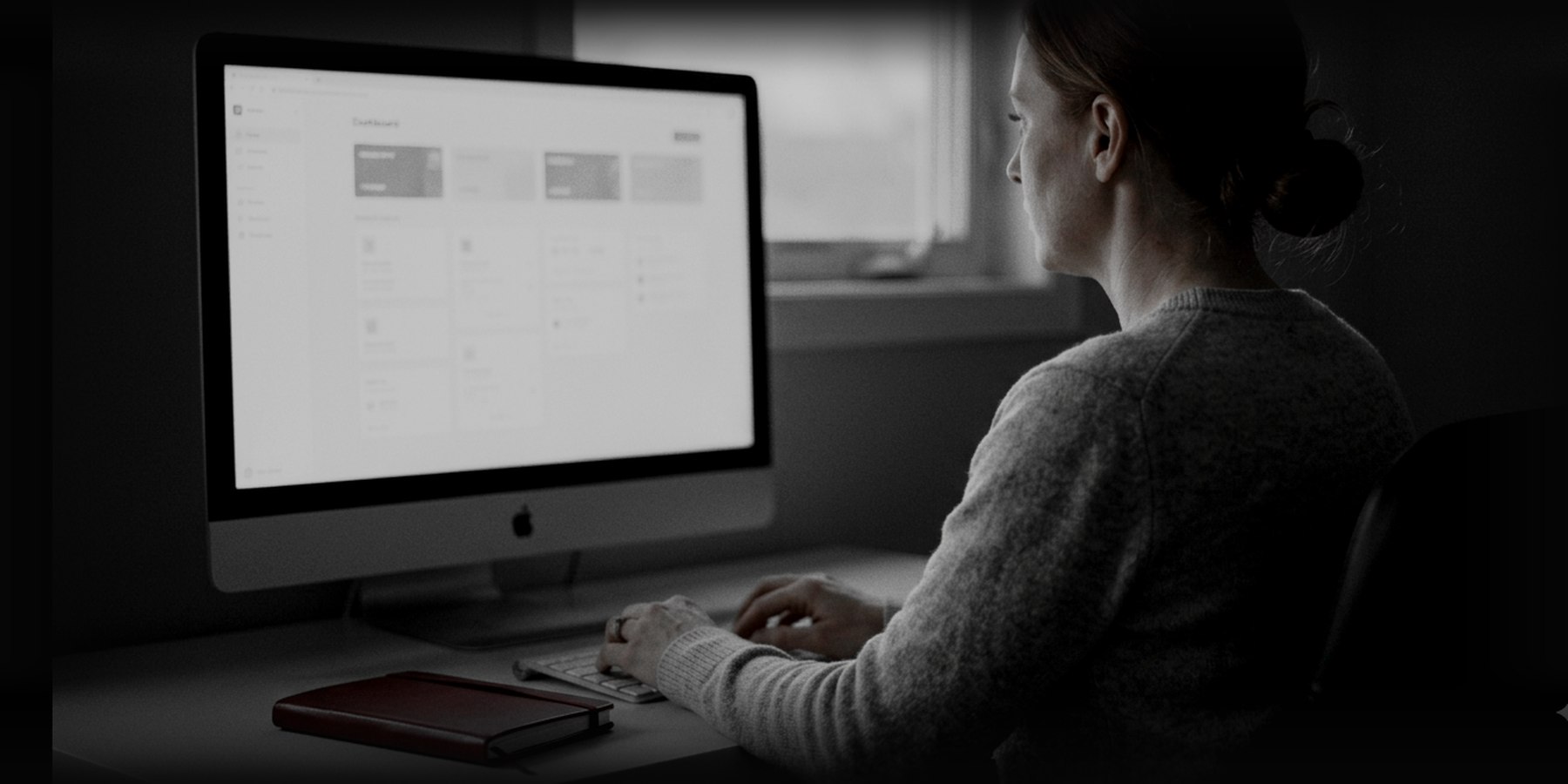 Back at her desk, the application running properly